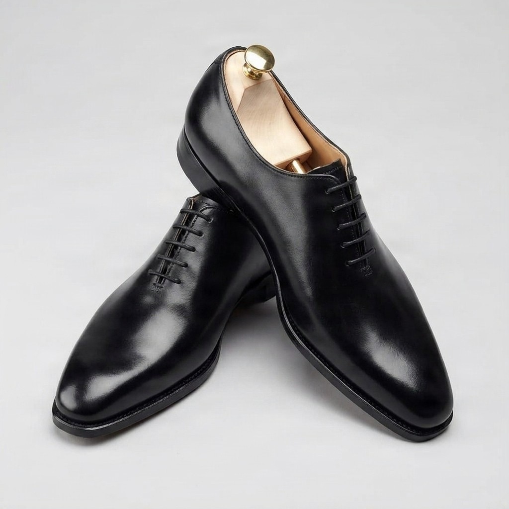 Black leather wholecut oxfords pointed toe