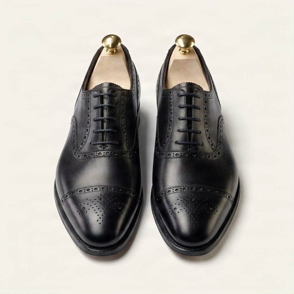 Men's black leather cap toe brogues medallion punched
