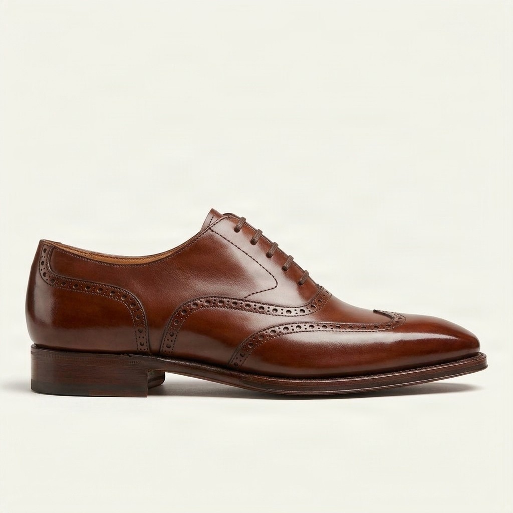 Cognac leather wingtip brogues medallion for men