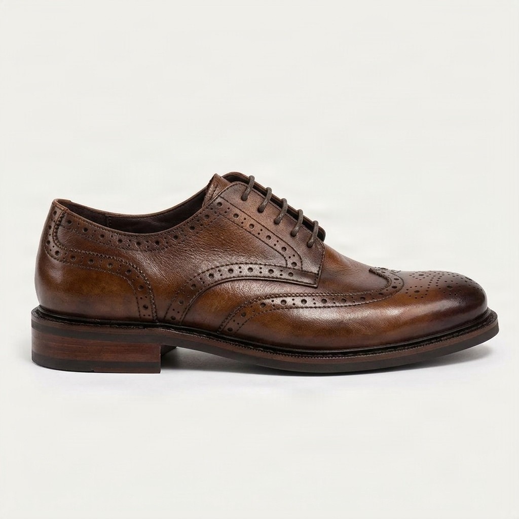 Brown leather wingtip brogues medallion for men