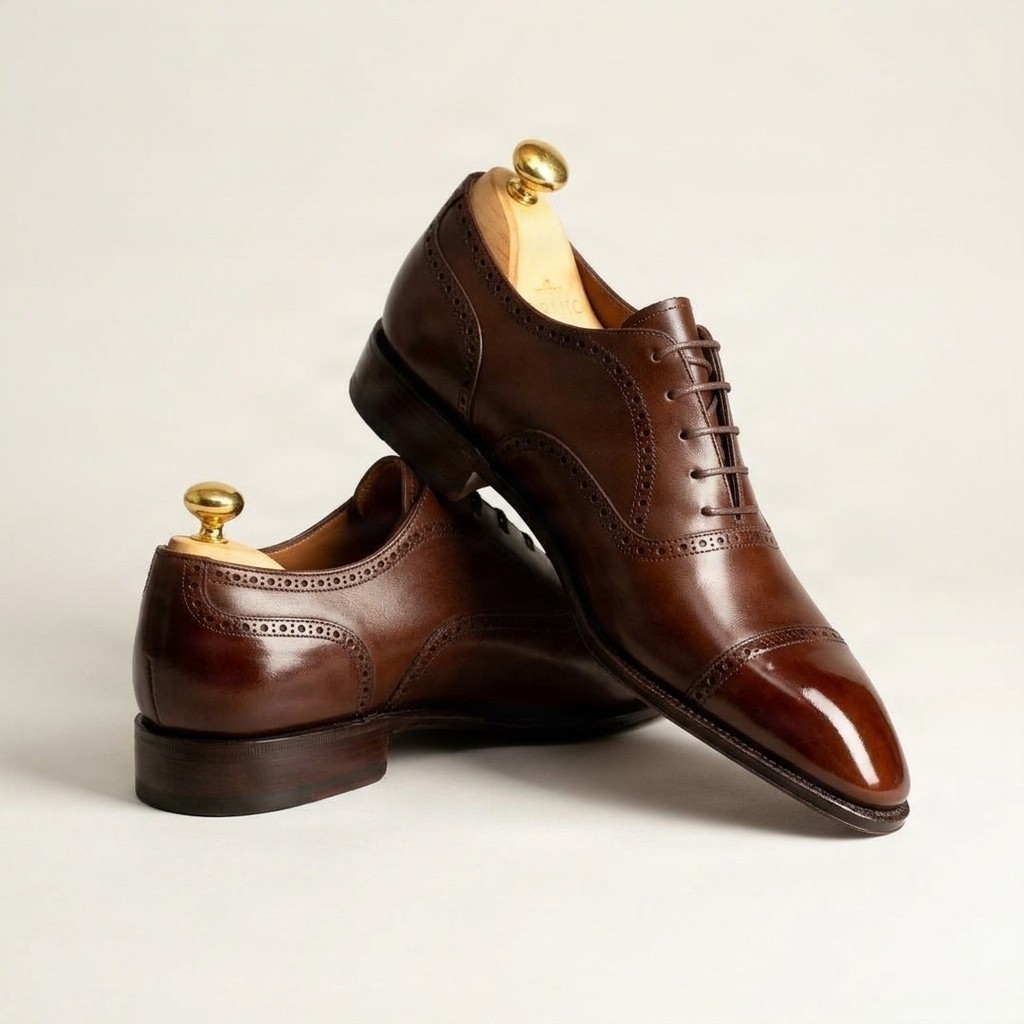 Brown leather cap toe brogues polished