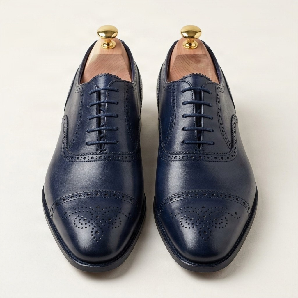 Navy leather cap toe brogues punched for men