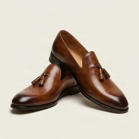 Brown leather tassel loafers plain toe
