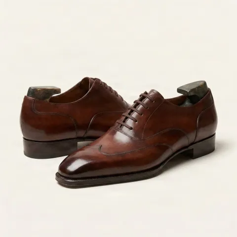 Brown leather wingtip shoes