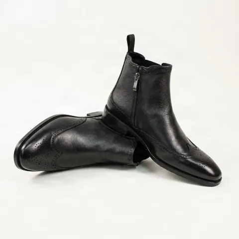 Black leather chelsea boots wingtip