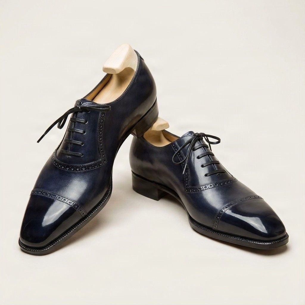 Navy leather cap toe brogues