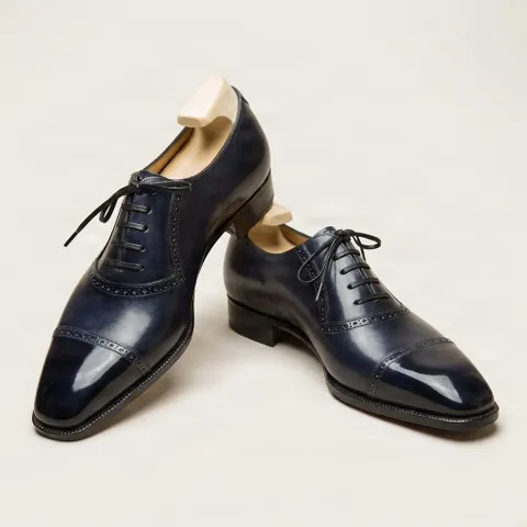 Navy leather cap toe brogues