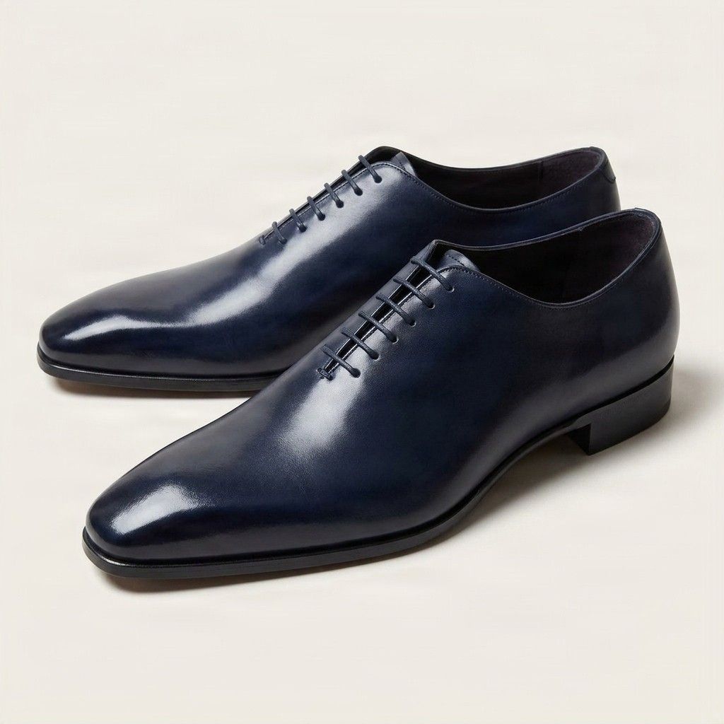 Navy leather wholecut oxfords