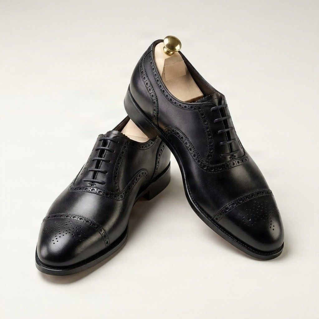 Black leather cap toe brogues medallion punched