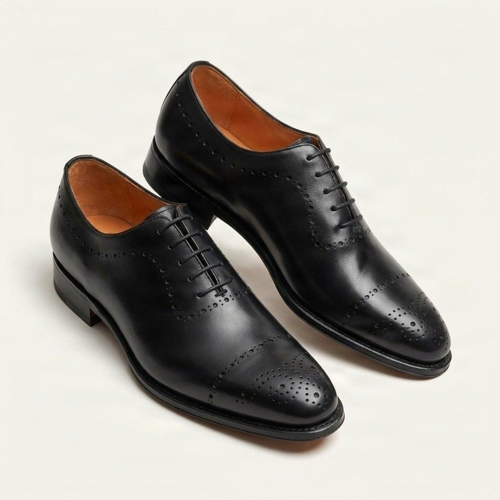 Black leather cap toe brogues punched