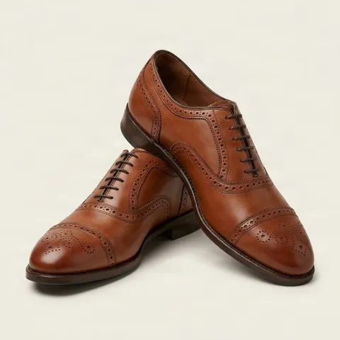Brown leather wingtip brogues toe