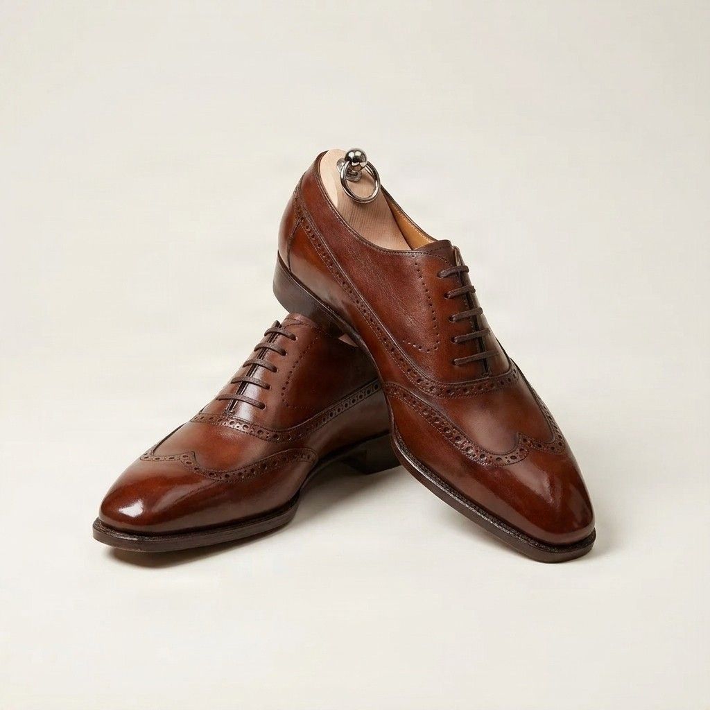 Brown leather wingtip brogues closed