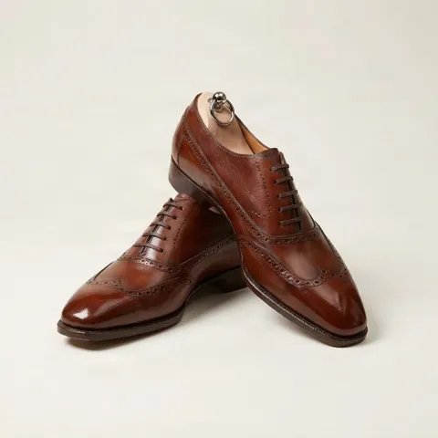 Brown leather wingtip oxford shoes