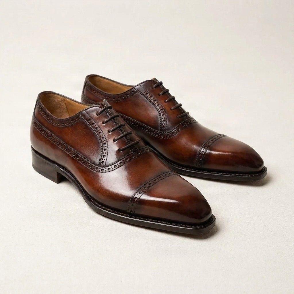 Brown leather cap toe brogues