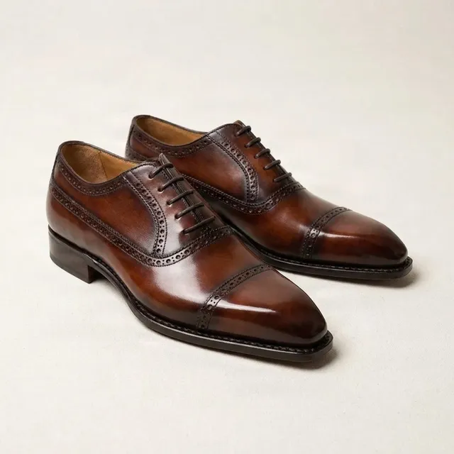 Brown leather cap toe brogues