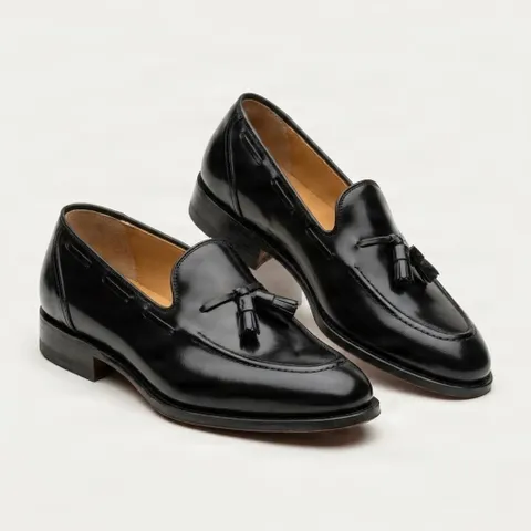 Black leather tassel loafers