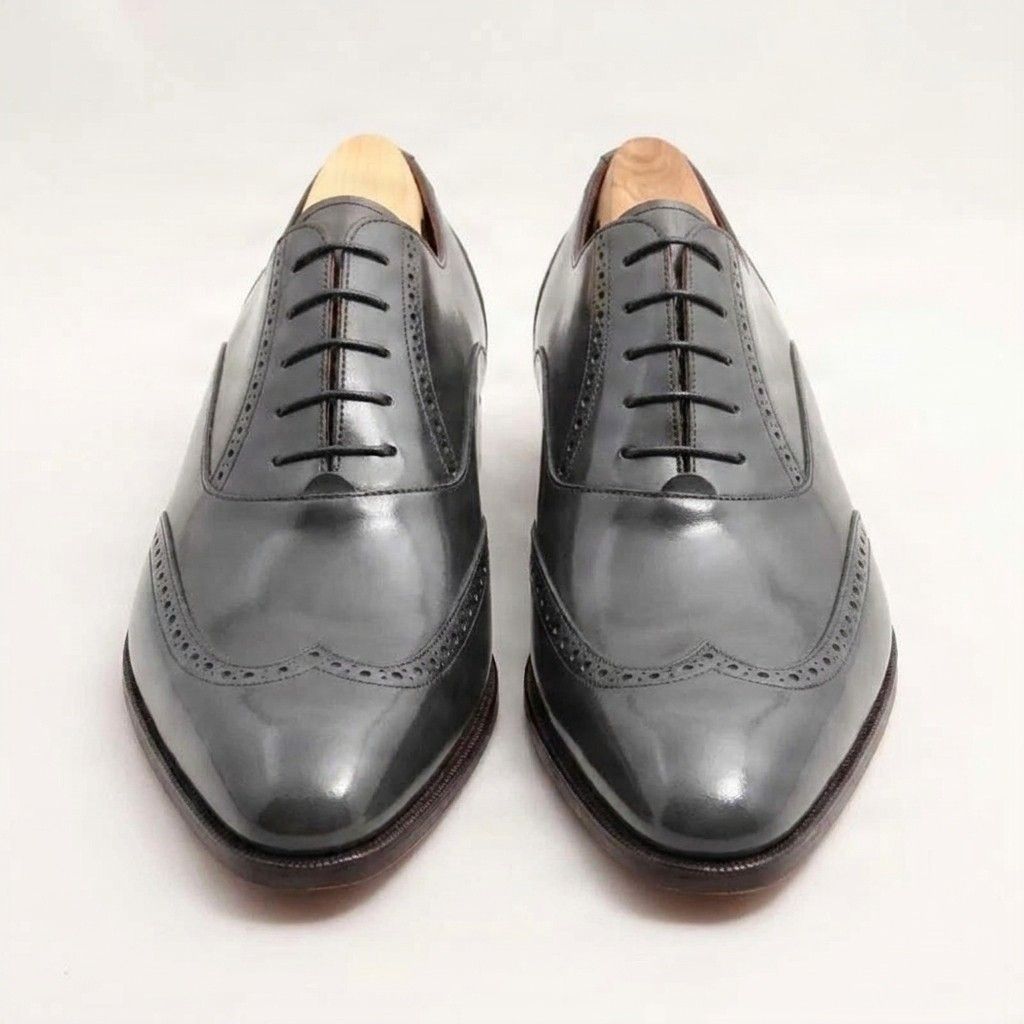Grey leather wingtip brogues