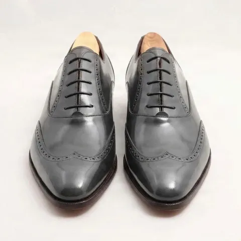 Grey leather wingtip brogues