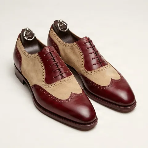 Burgundy and beige wingtip leather shoes