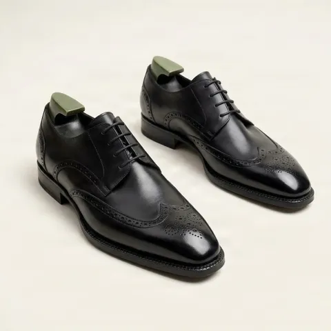 Black leather wingtip brogues