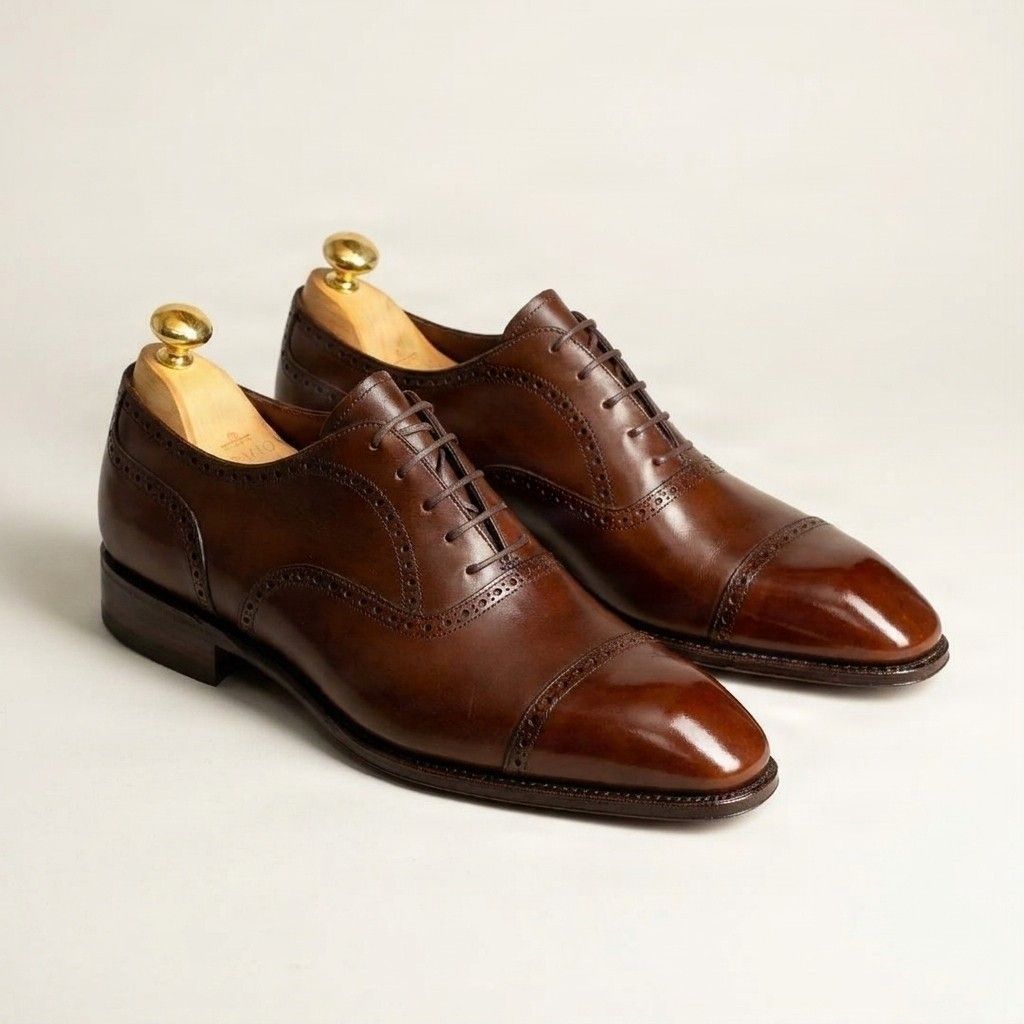 Brown leather cap toe brogues heel