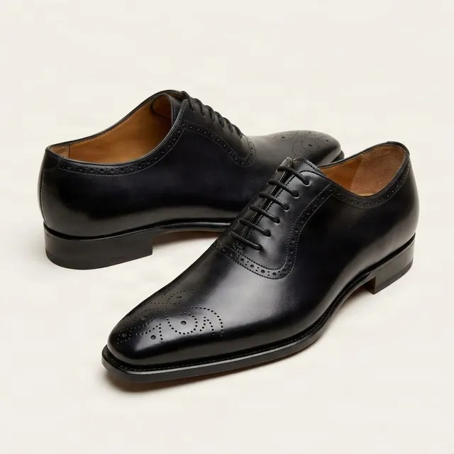 Black leather brogues medallion