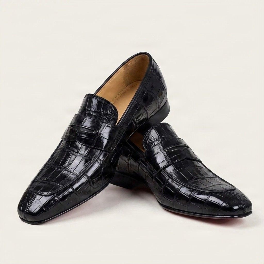 Black crocodile penny loafers