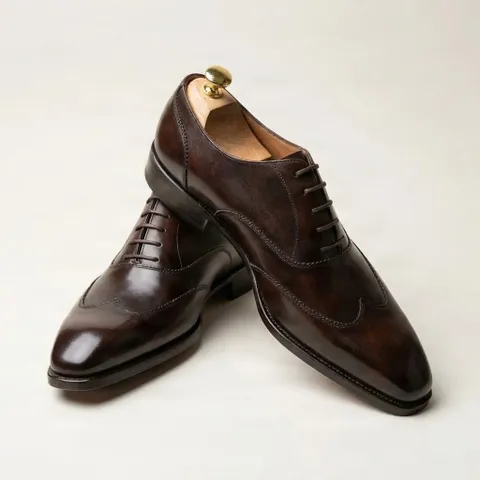 Brown leather wingtip shoes