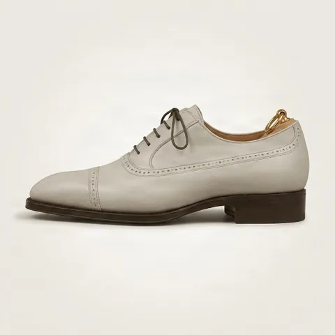 Grey leather cap toe brogues