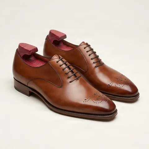 Cognac leather brogues medallion