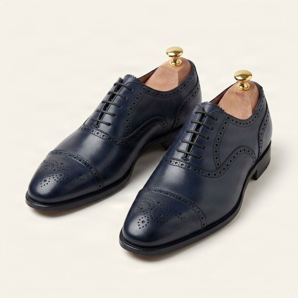 Navy leather cap toe brogues punched