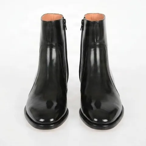 Black patent leather chelsea boots