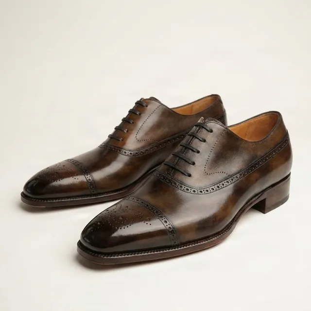 Brown leather cap toe brogues punched seams