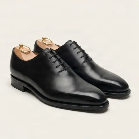 Black leather wholecut oxfords
